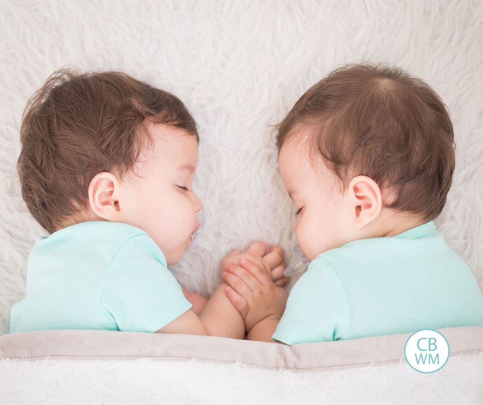 twins wearing light blue sleepingExpecting twins? 💛 My guest twin mom shares five tips for getting two babies on the same schedule, from feeding and sleeping them together to knowing where you're headed next.