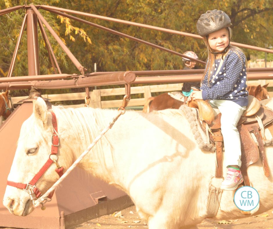 Brinley riding a mini horse