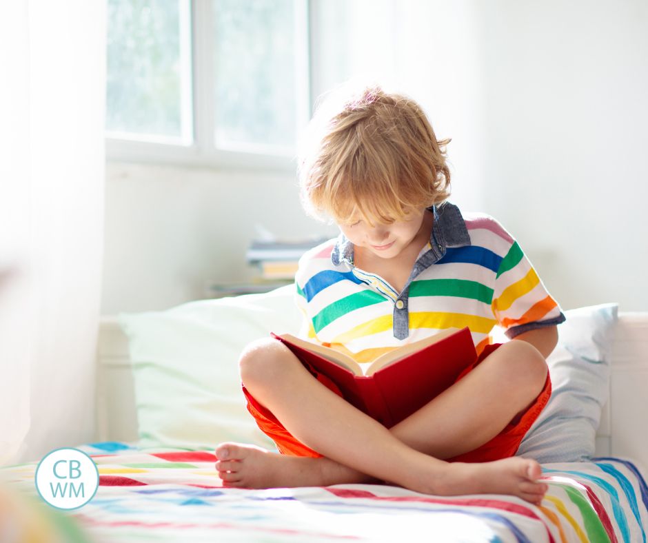 Child reading on the bed