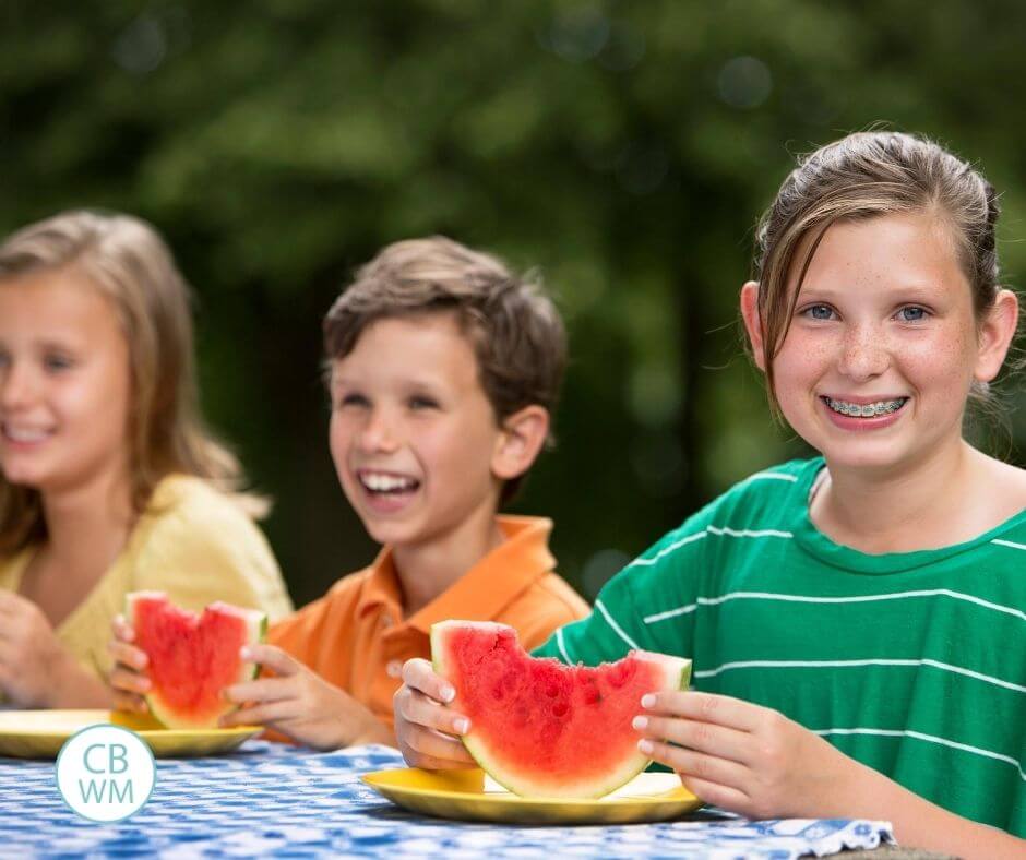 Kids eating watermelon