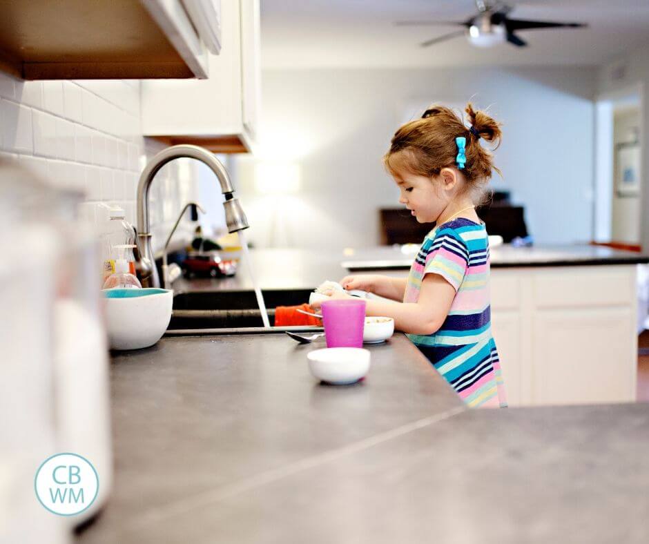 Preschooler doing chores