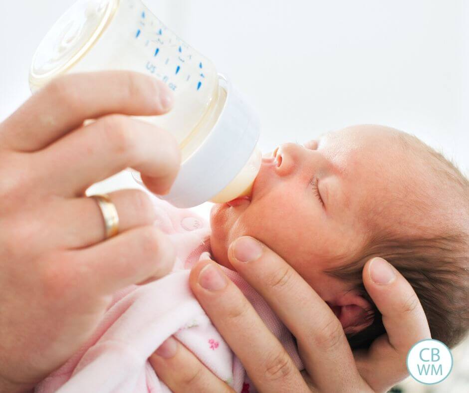 Dreamfeed hero image. Feeding baby with a bottle