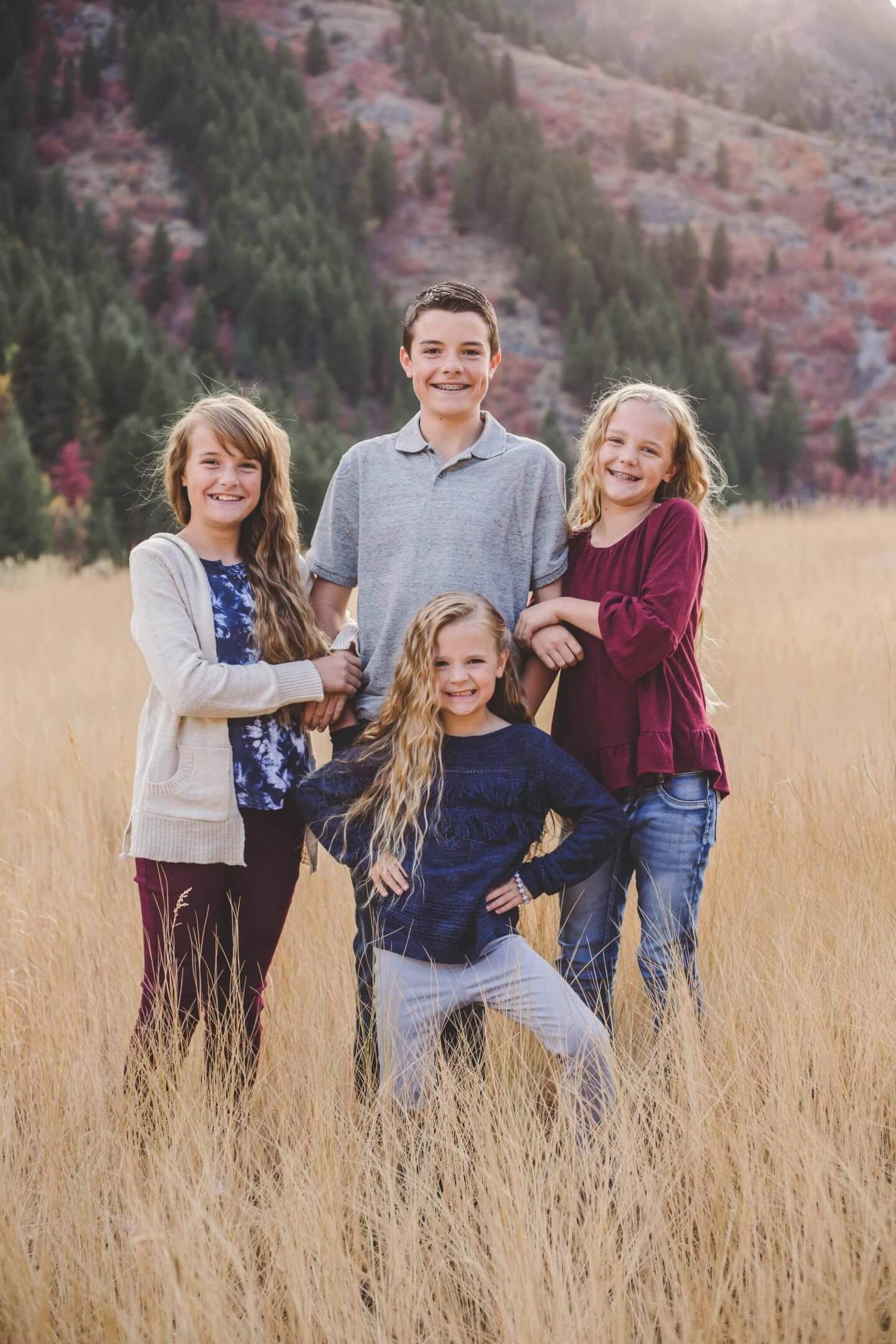 Family photos. Four children in the mountains. 