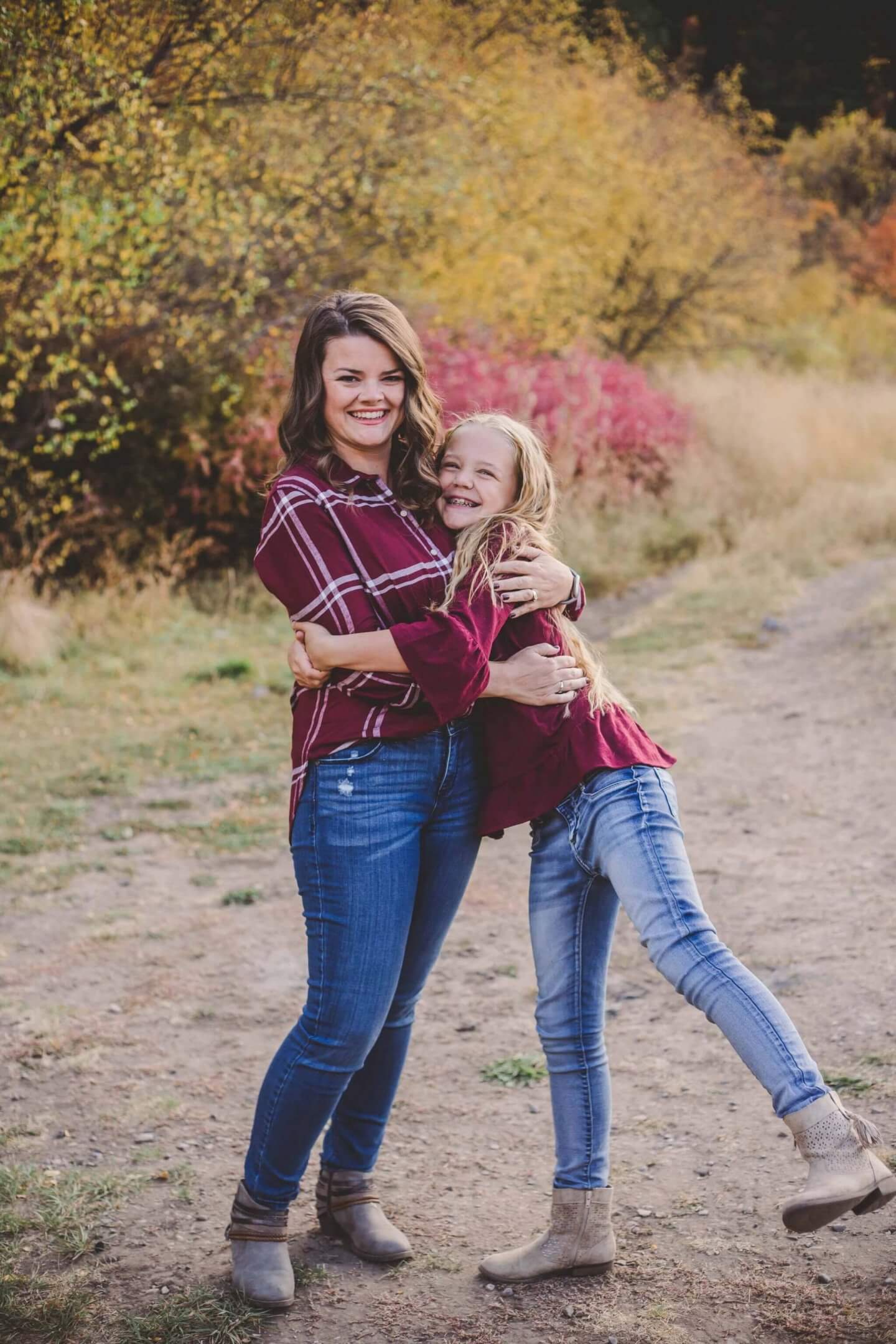 Mother and daughter hugging. Fall photos. 