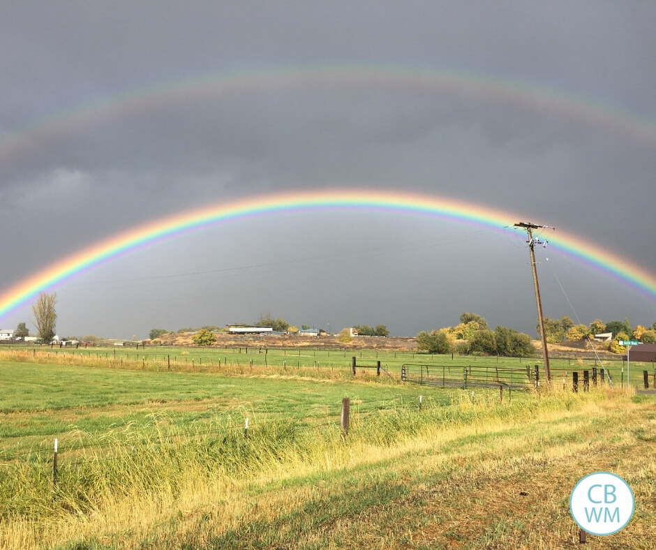 Double rainbows over a field.