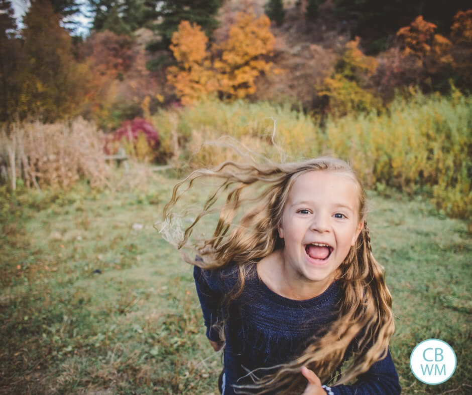 Six year old girl running joyfully