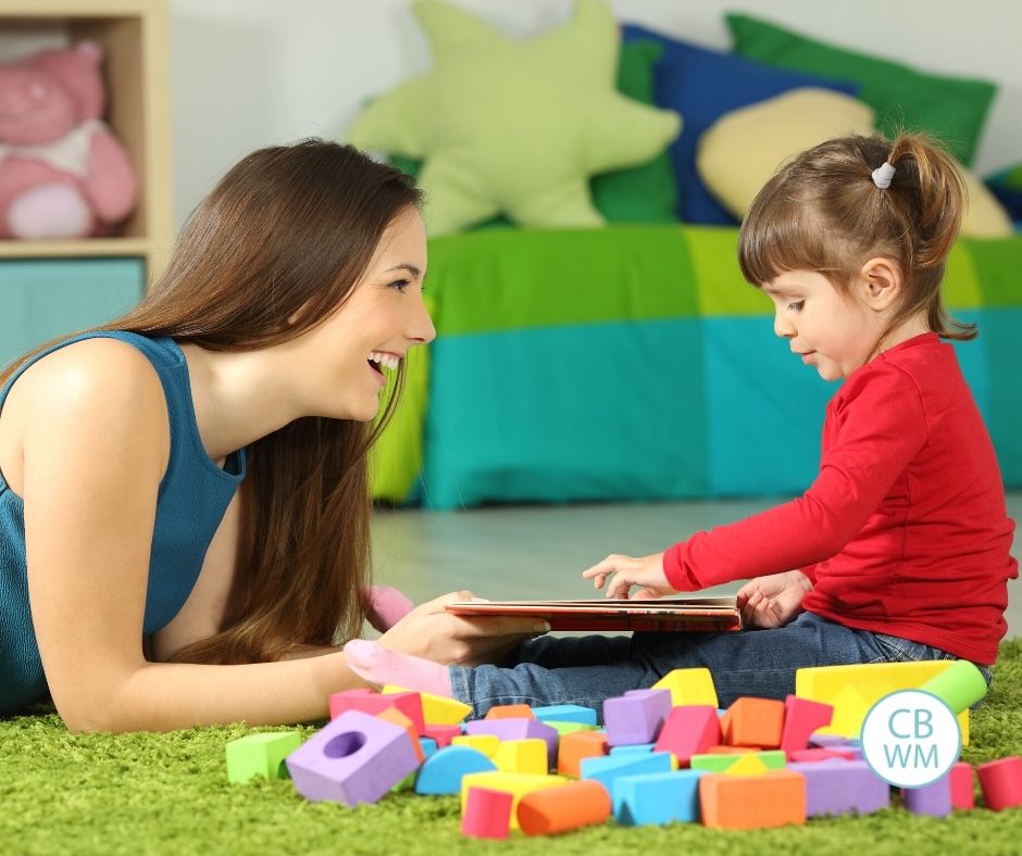 Mom and toddler playing with toys