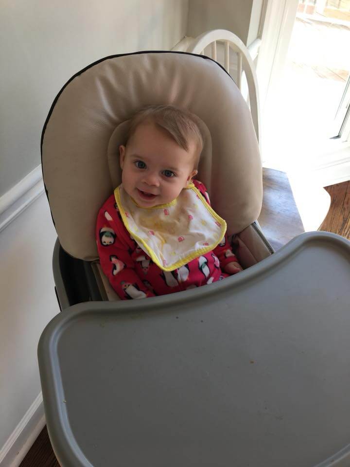 7 month old baby sitting in high chair