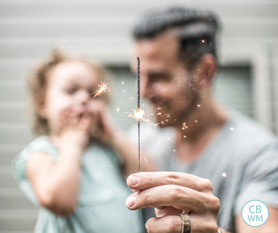 Father celebrating with a toddler girl