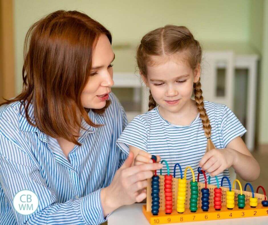 Mom and daughter doing preschool at home