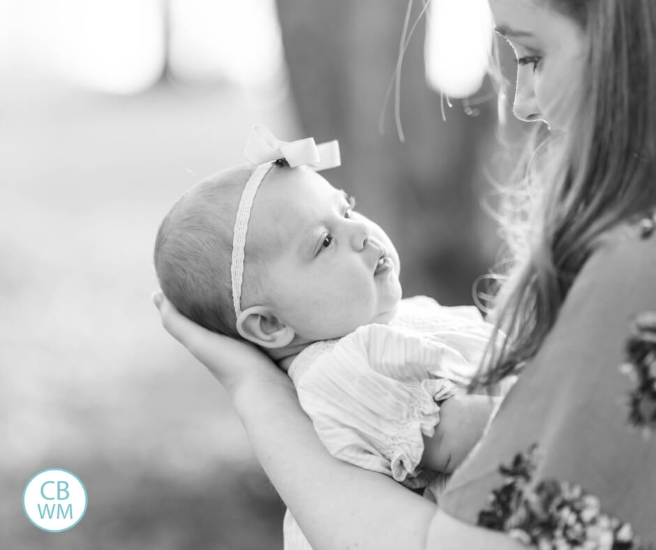 mother holding baby girl