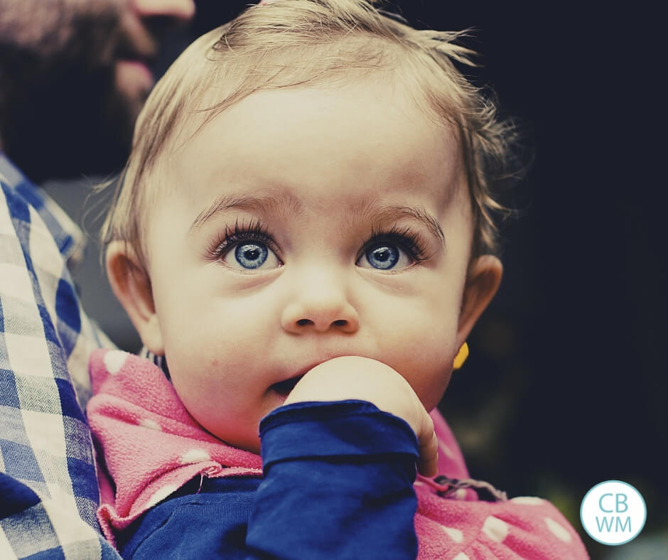 Baby with blue eyes looking up.