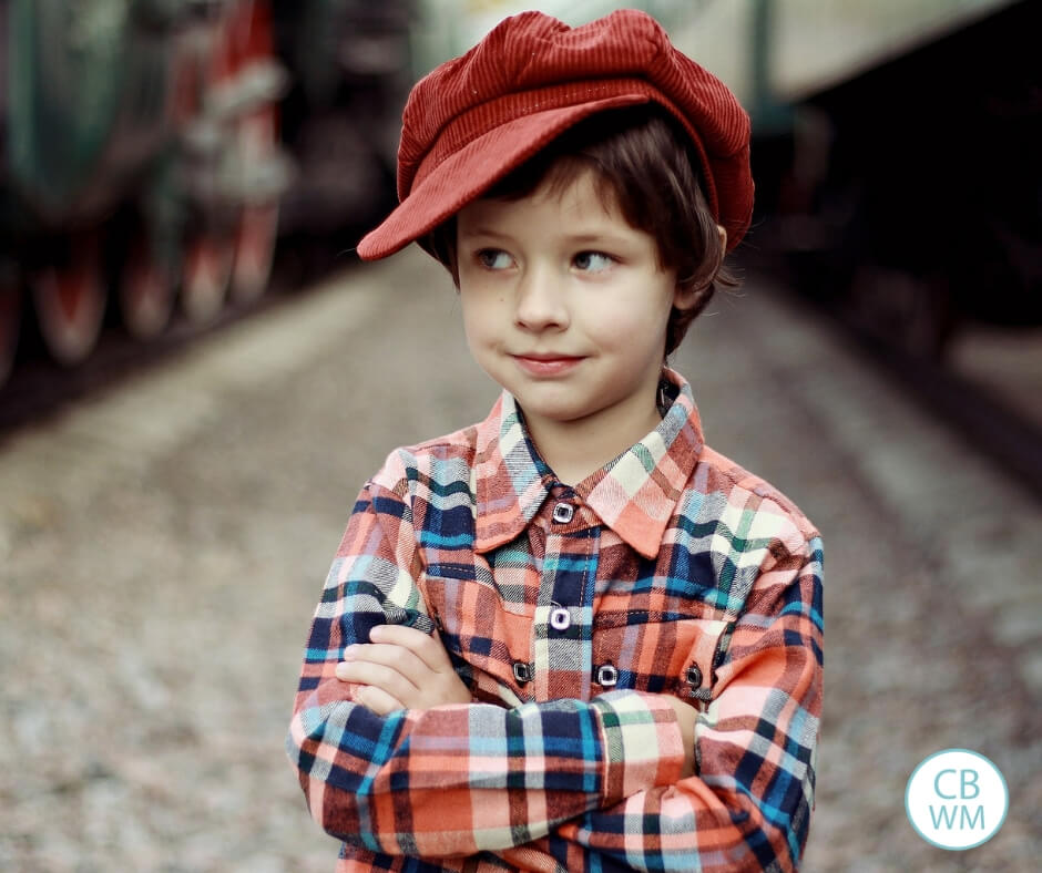 Boy looking to the side while wearing a cap on his head