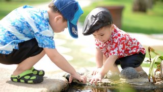 Two boys playing in the water