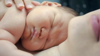 Newborn lying on mom's chest