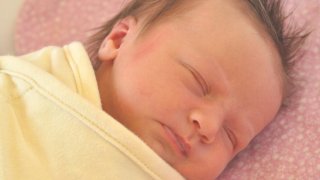 Baby in a bassinet