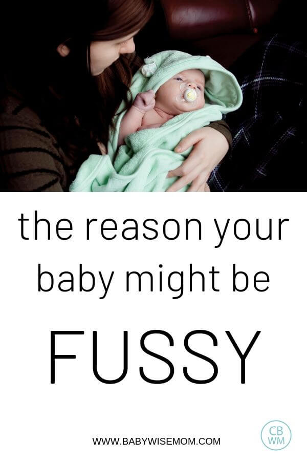 Pinnable image of a mom holding a fussy baby
