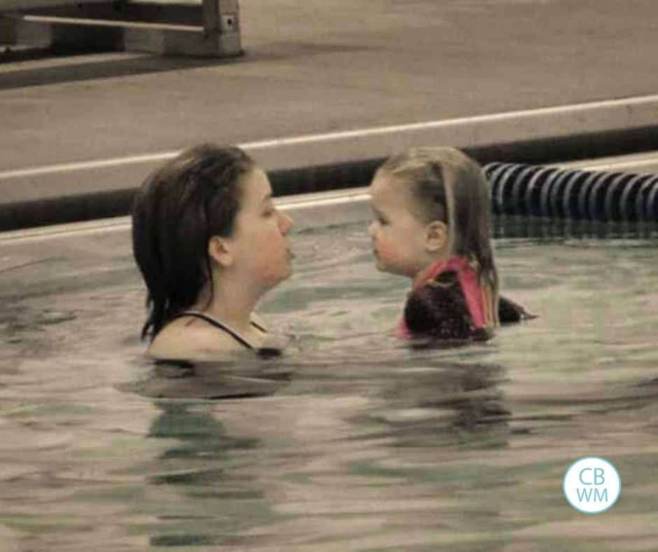 Brinley in the pool with her swim teacher
