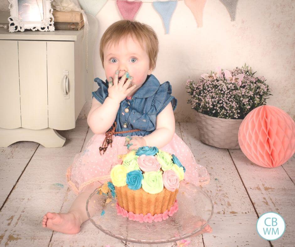 Birthday cake and a girl eating it