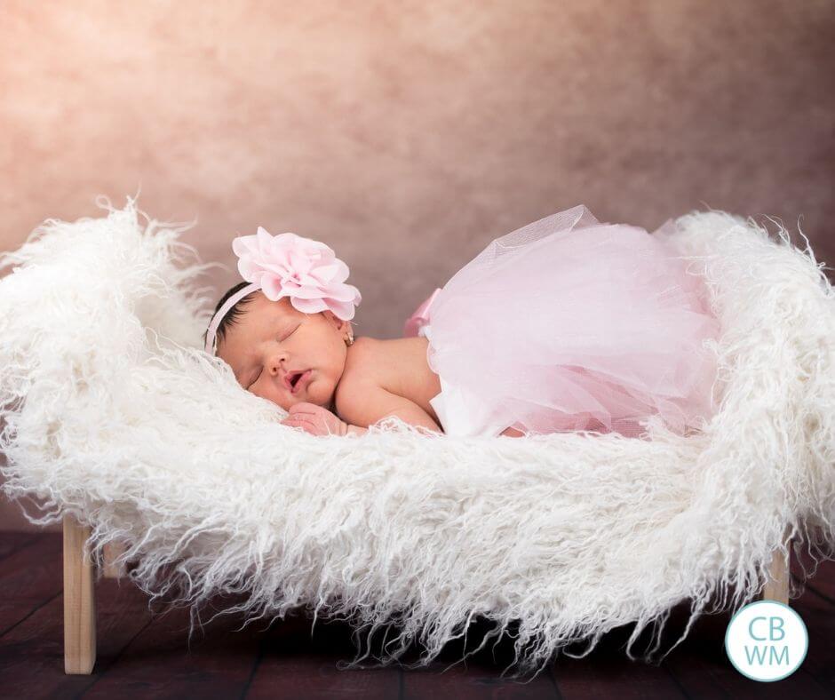 Baby girl sleeping in a pink tutu