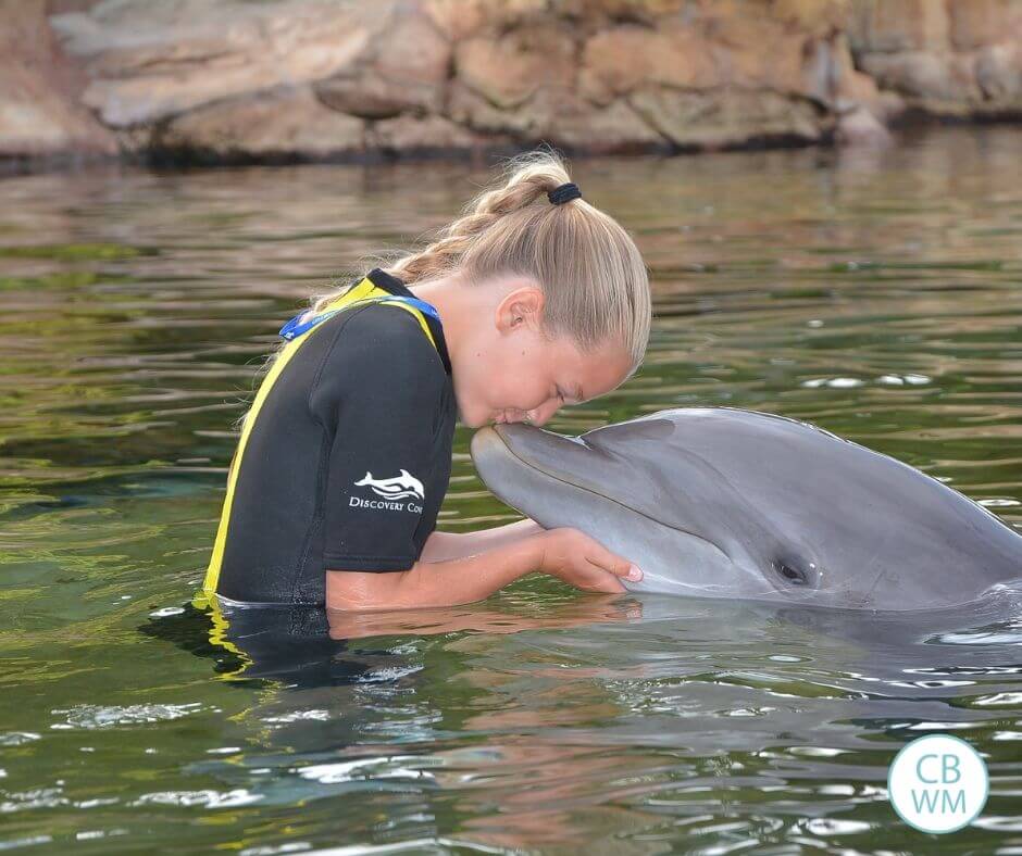 McKenna kissing a dolphin