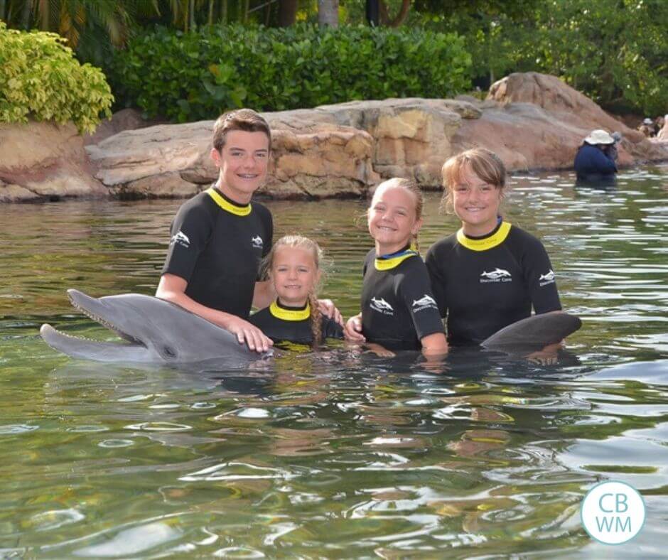 Children swimming with the dolphin Rosie at Discovery Cove