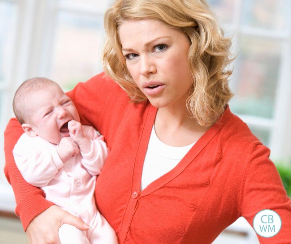 Mom holding fussy baby