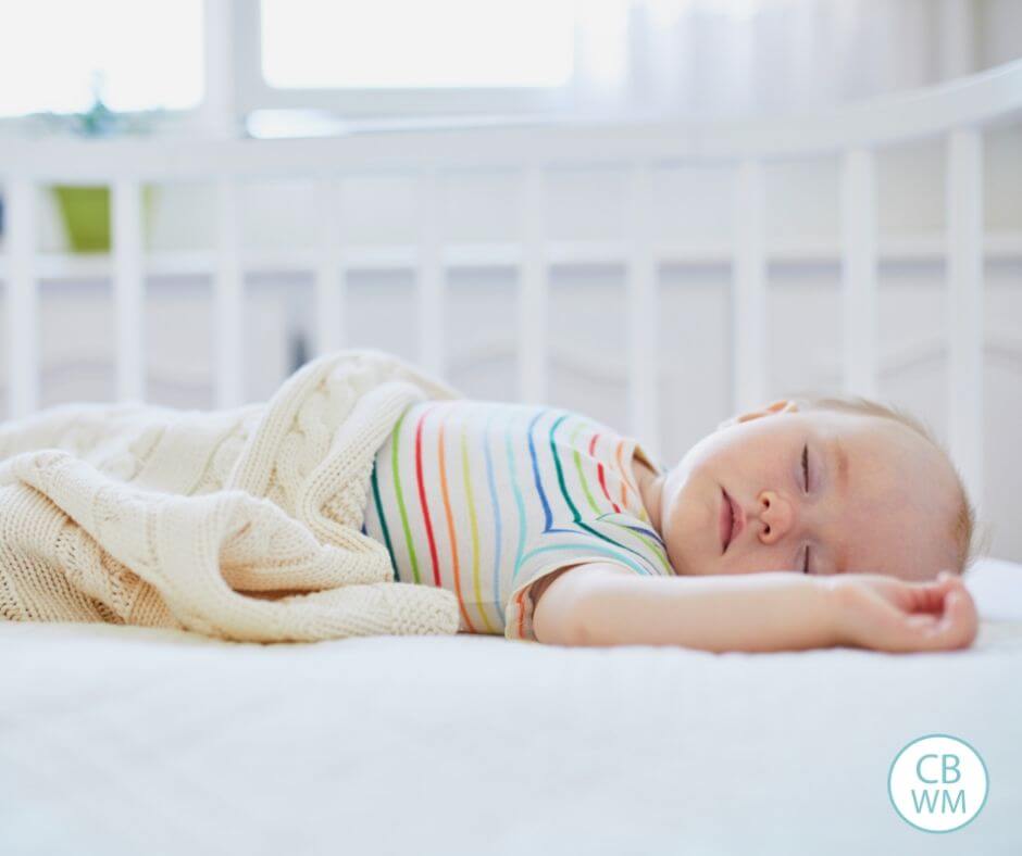 newborn sleeping in crib