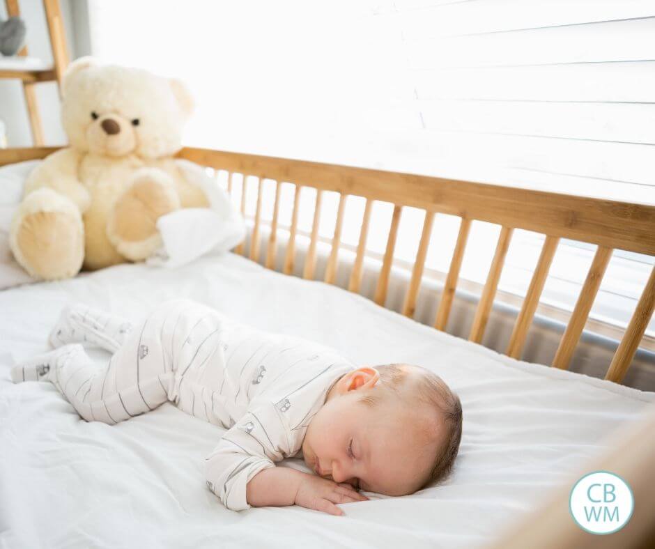 newborn sleeping in crib