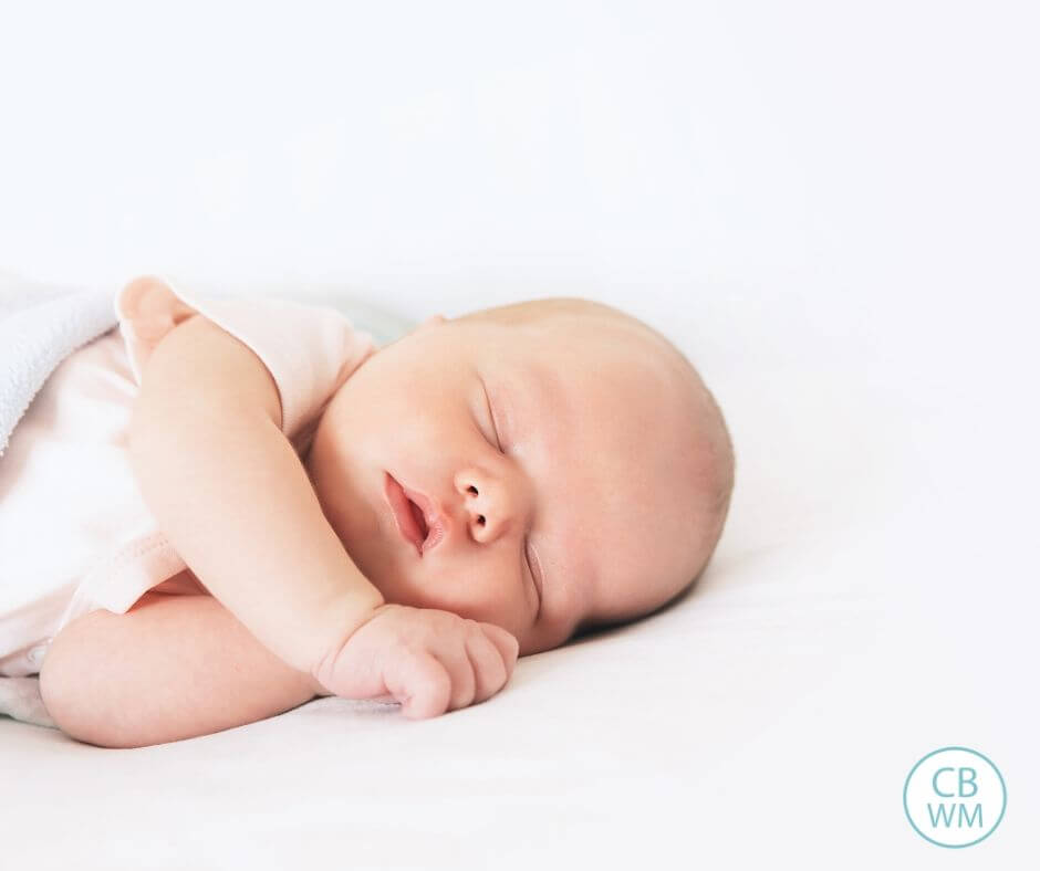 Baby sleeping peacefully with white background