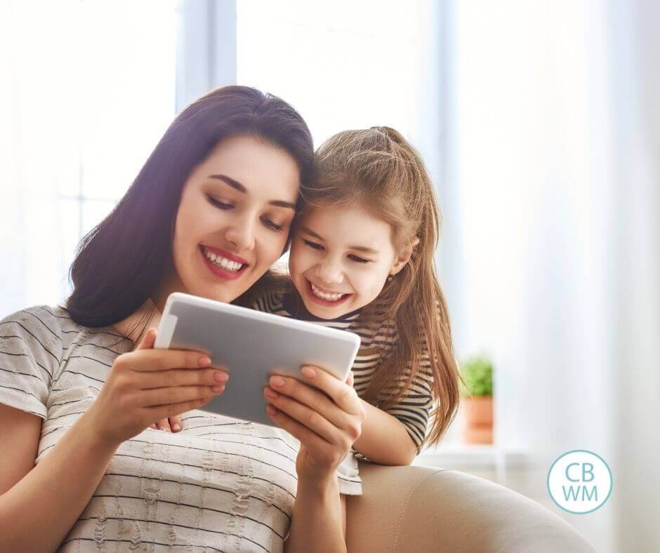 Mom and daughter consulting a schedule