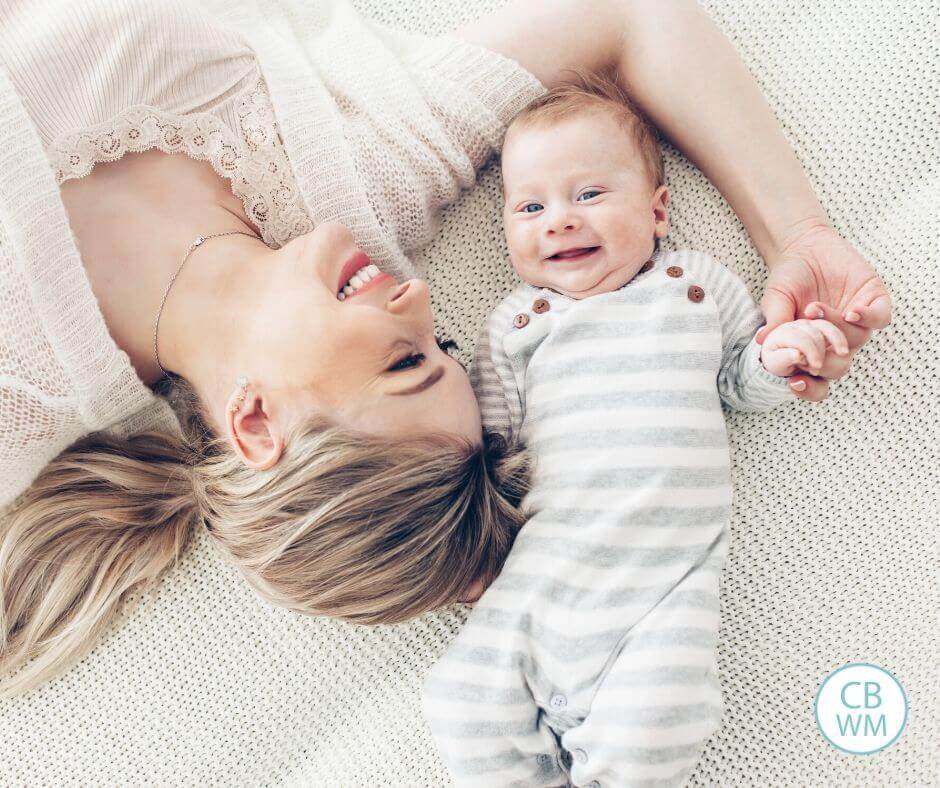 Mom and baby lying on the bed