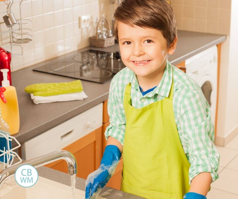 boy doing the dishes