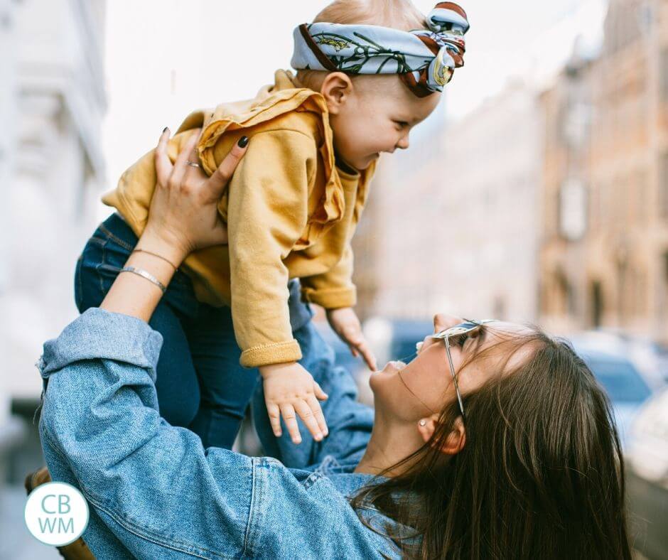 Mom holding baby in the air