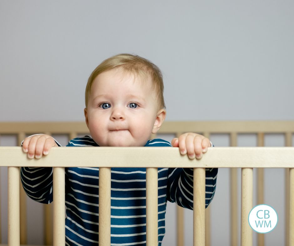 Baby standing in crib