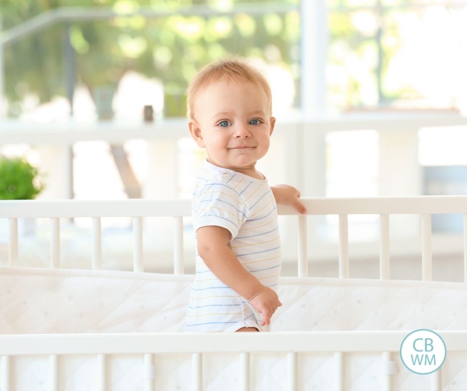 smiling baby in crib