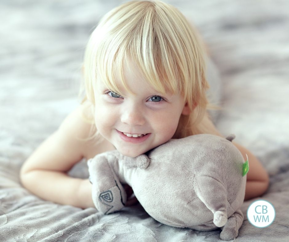 child smiling on bed