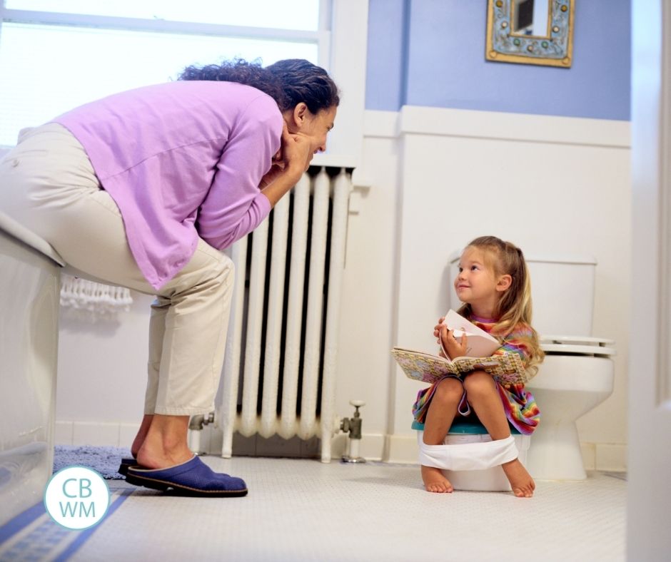 Mom potty training her daughter