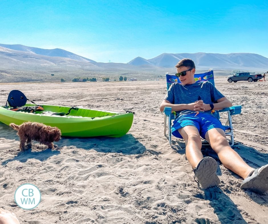 Brayden on the beach with our new puppy