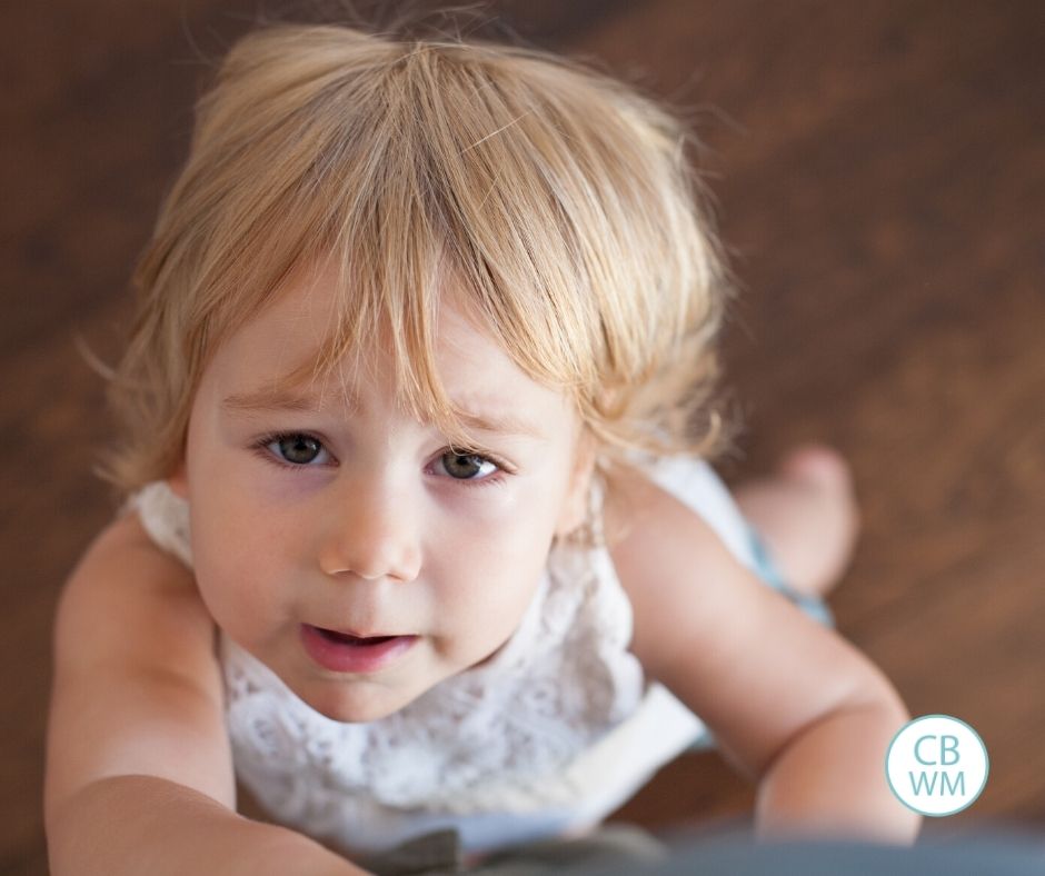 Child whining looking up at camera