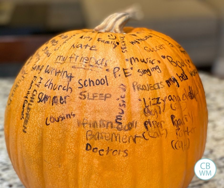 pumpkin covered in written things we are thankful for