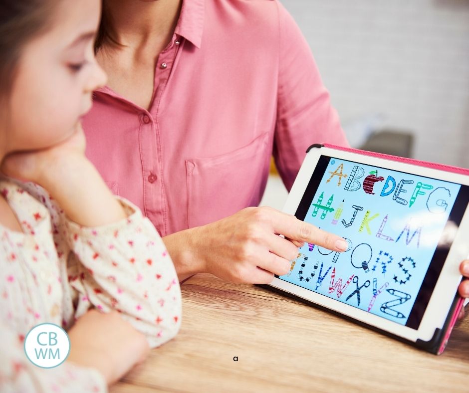 Child learning the alphabet on the tablet