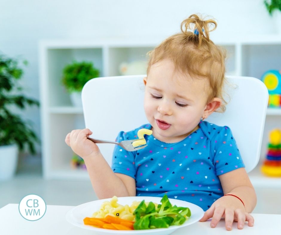 baby eating family meal