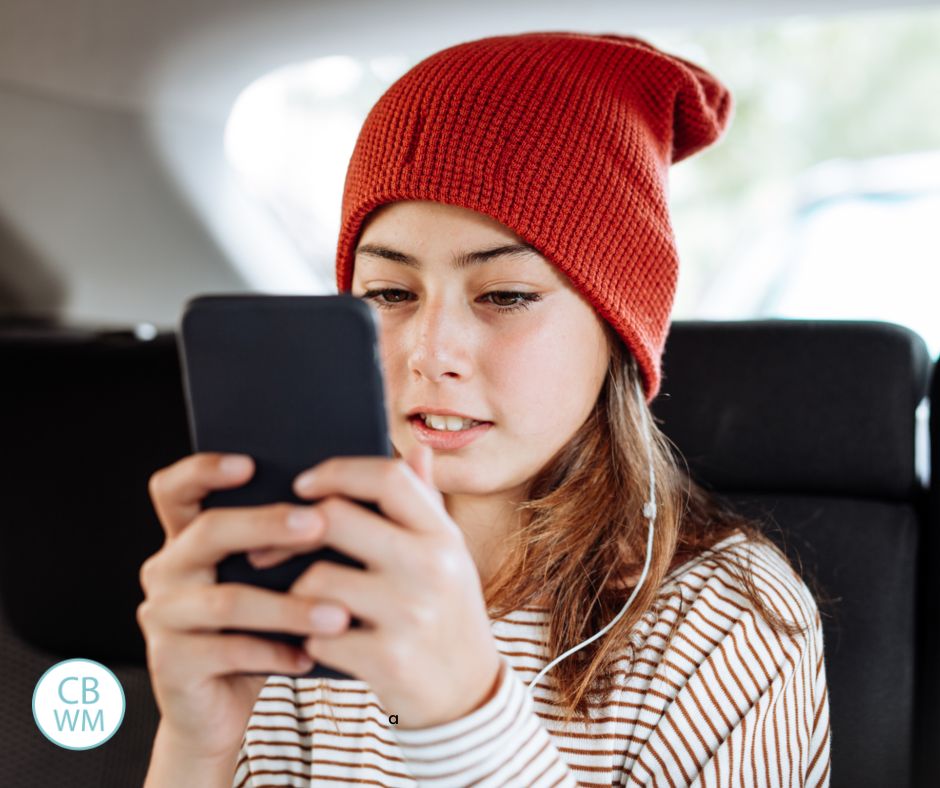 Teen on an iPhone in the car