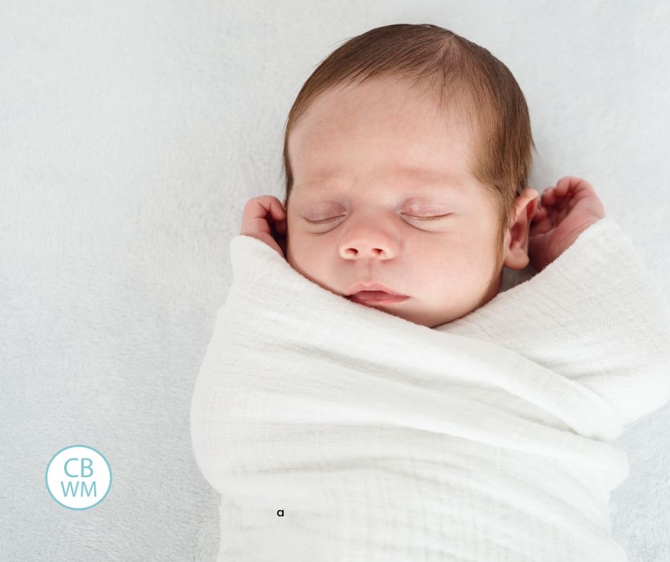 baby sleeping loosely swaddled