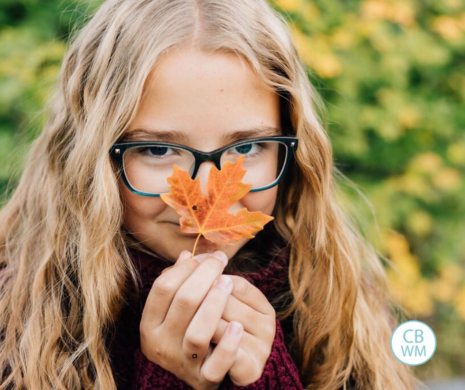 10 year old Brinley holding a leaf up