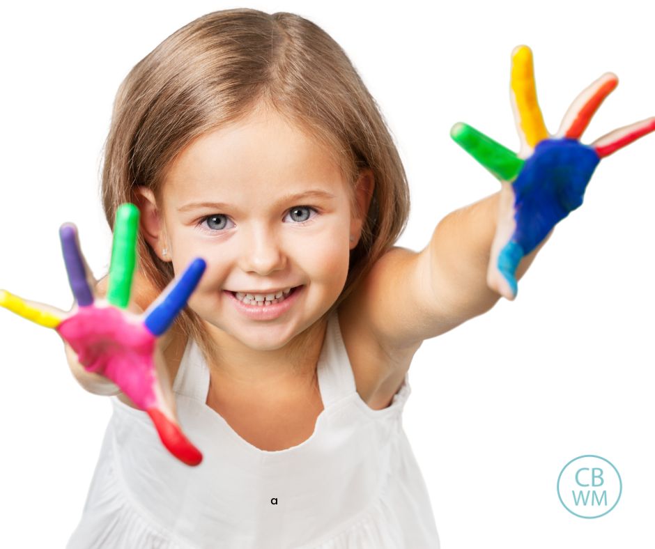 Preschooler with hands painted