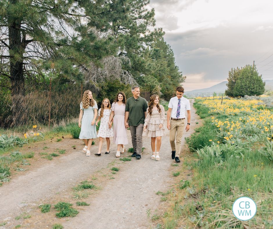 Our family walking down a dirt road in 2023