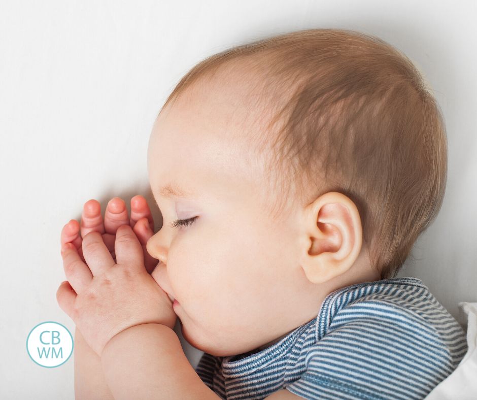 Baby sleeping and sucking thumb