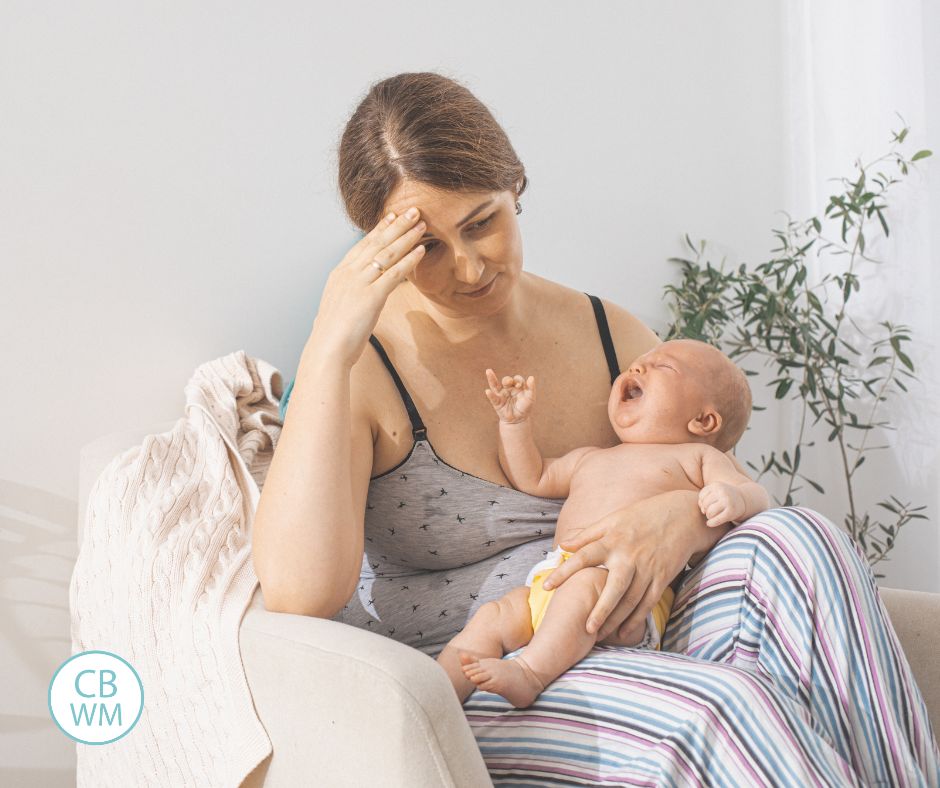 Mother holding a frustrated baby